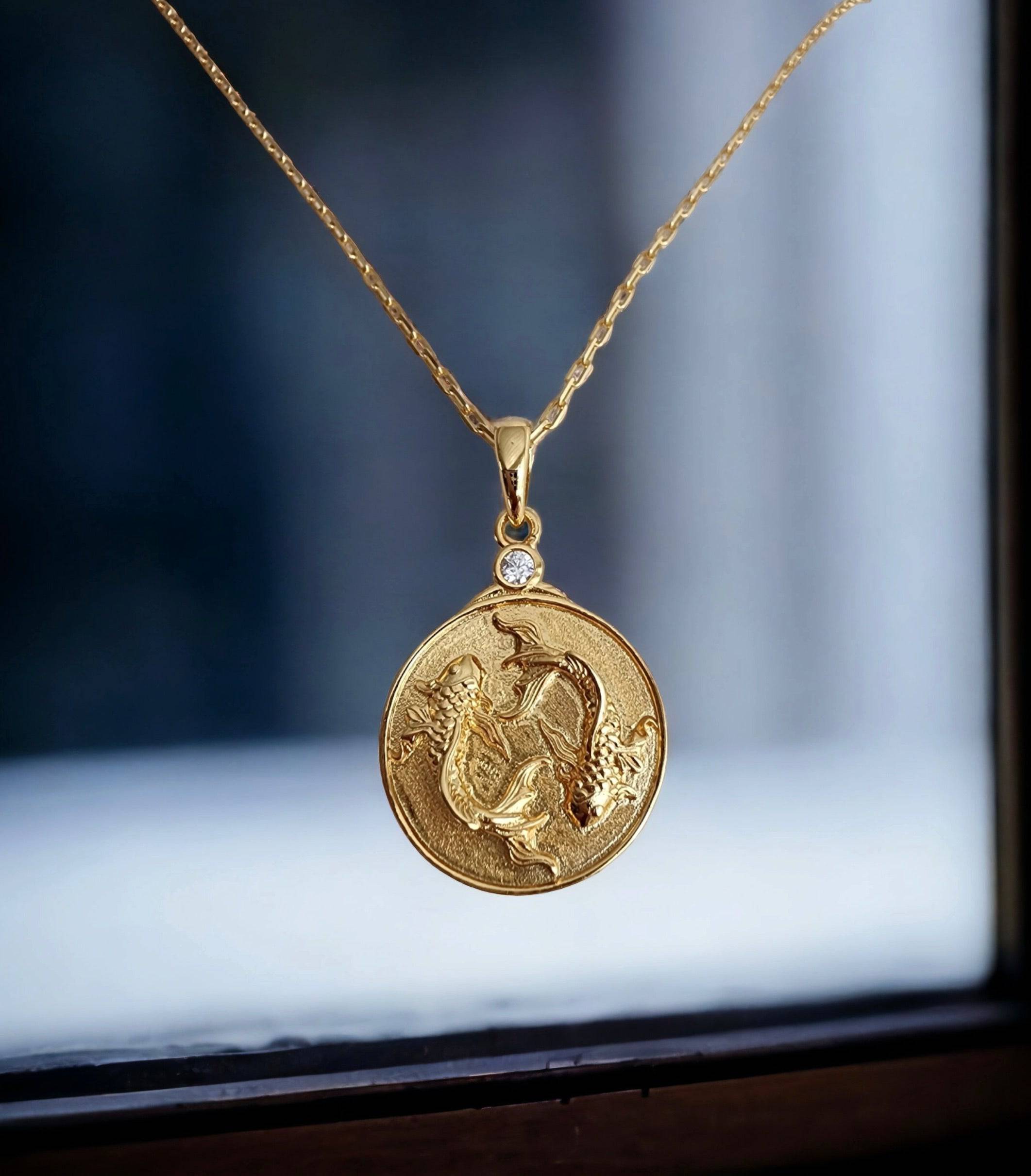 Gold Zodiac Pisces Medallion Necklace featuring a Pair of Fish