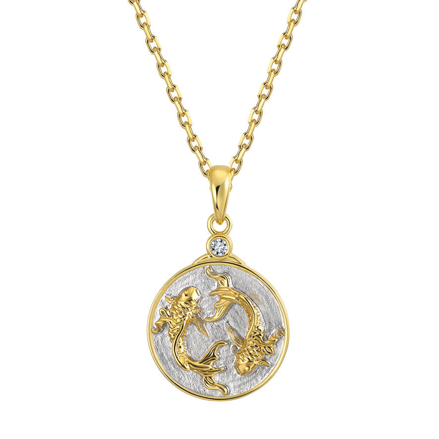 Gold and silver Pisces Zodiac pendant necklace on a white background