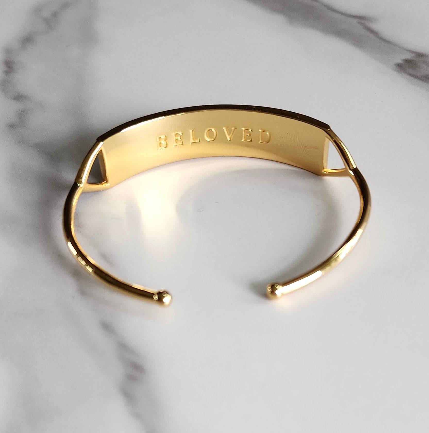 Touchstone Beloved Cuff Gold showing "Beloved" in plain text on reverse