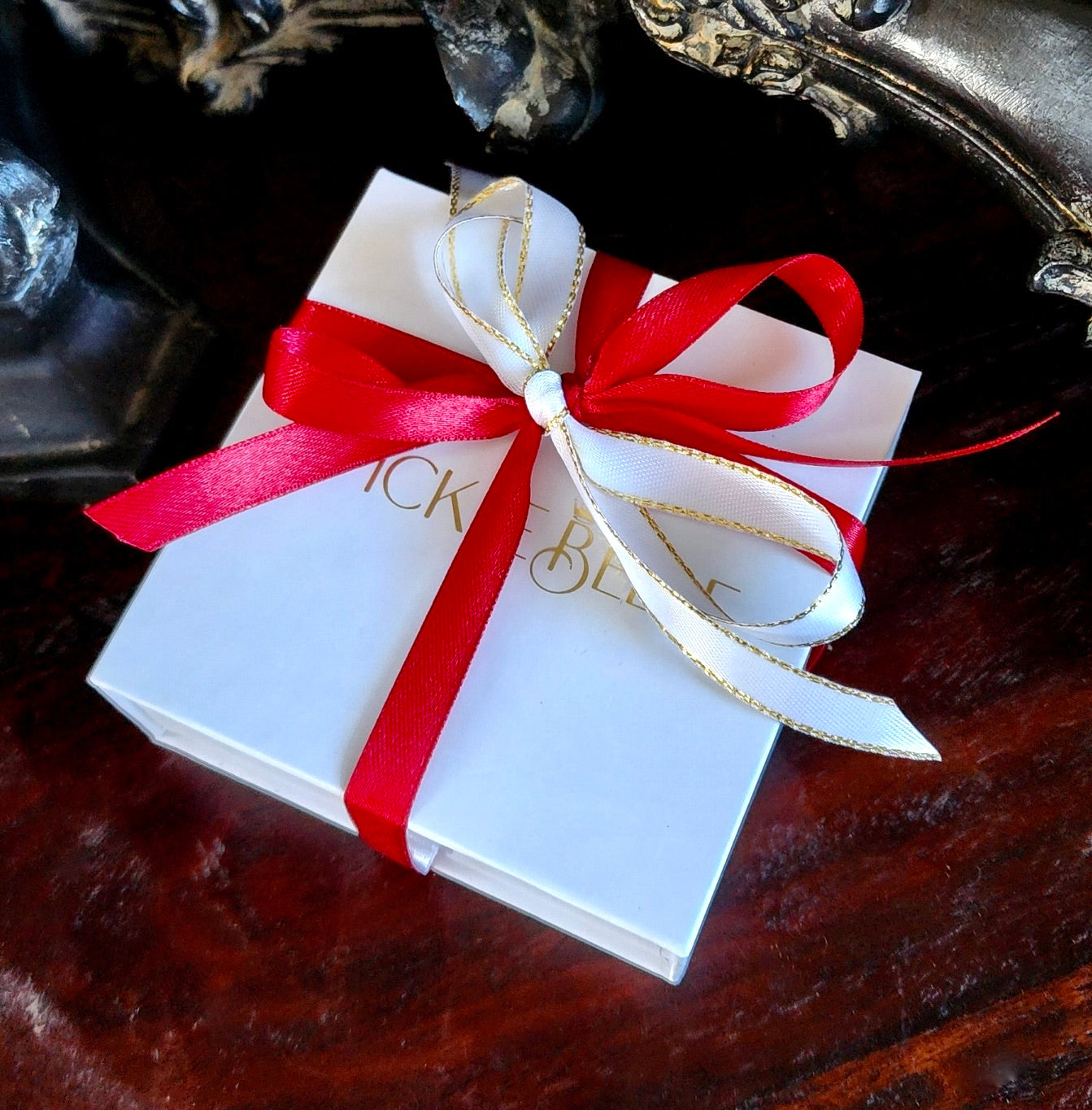 Picklebelle Box wrapped in red and white bows