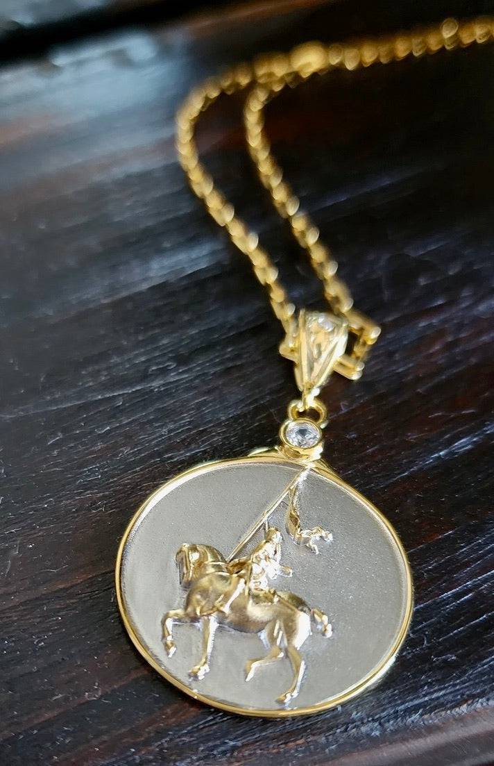 Saints and Saviors Joan of Arc March Pendant Necklace depicting Joan of Arc on a horse side view two-tone silver and gold