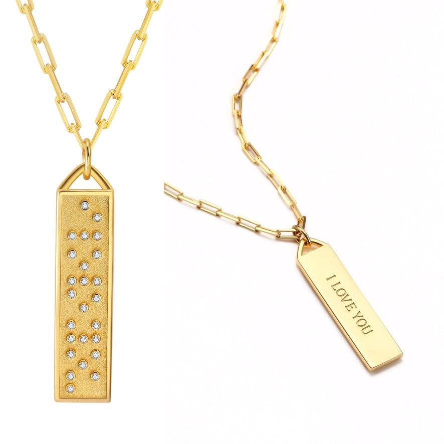 Touchstone I Love You Bar Necklace Gold shows "I Love You" in Braille Crystals and engraved in plain text on reverse