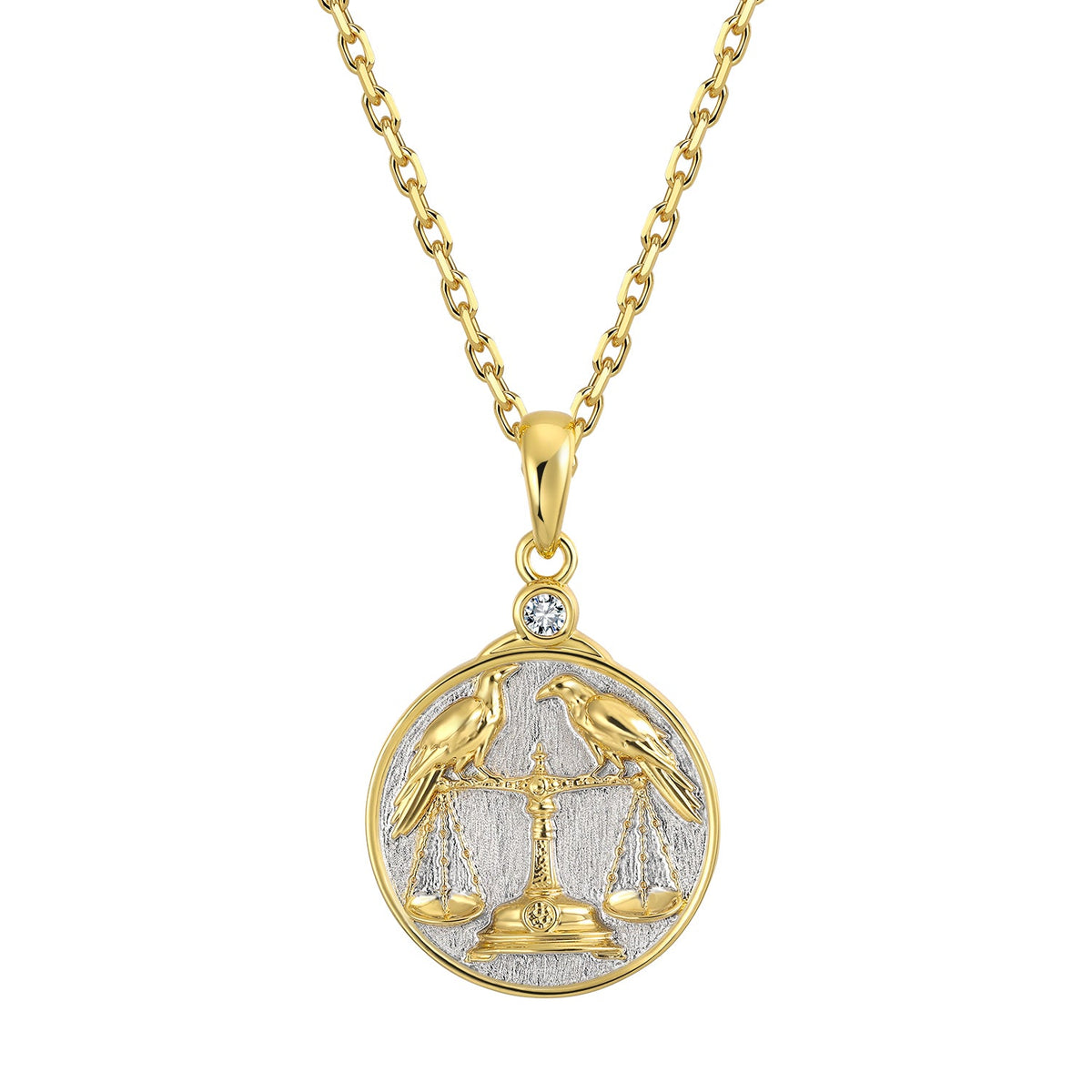 Gold and silver necklace with a Libra Scales with Two Ravens zodiac pendant on a white background