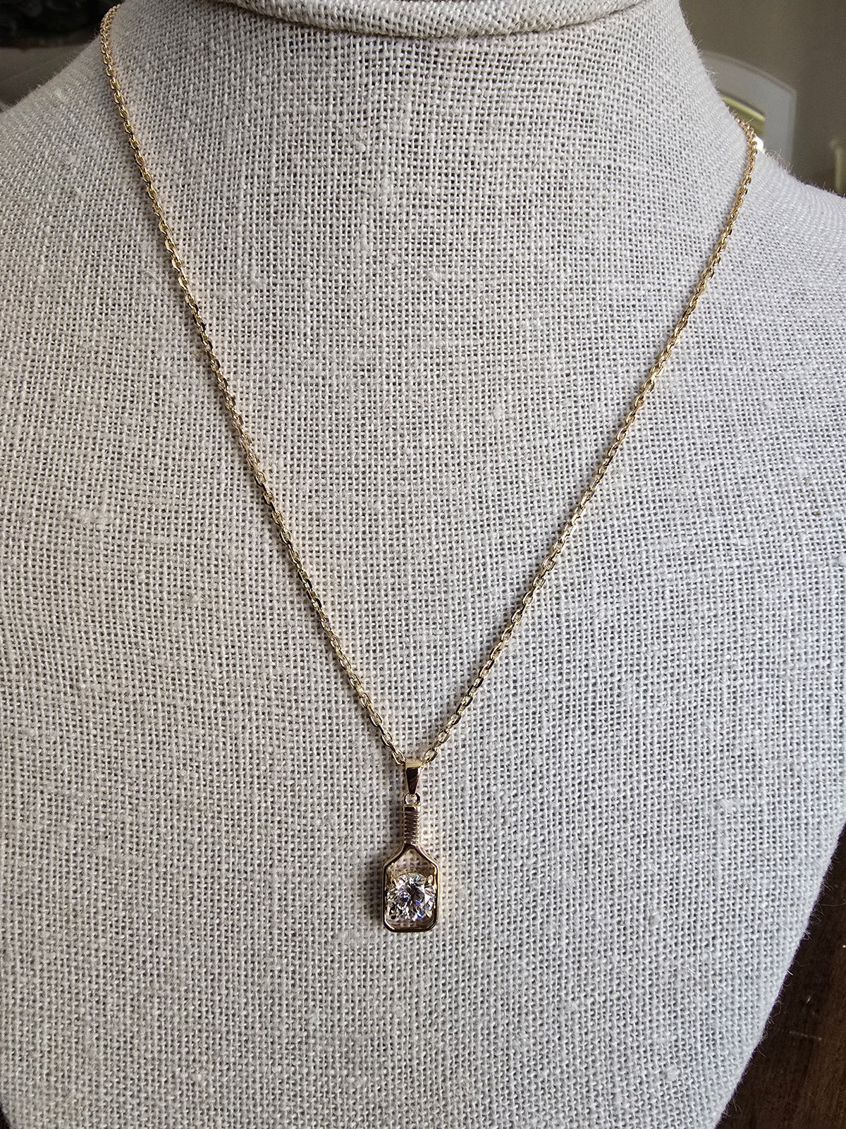 Necklace with a pendant on a mannequin bust