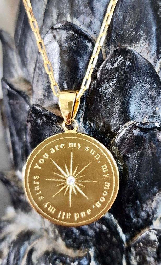 Saints and Saviors Over The Moon Blue Pendant Necklace reverse with text engraved "You are my sun, my moon and all my stars"