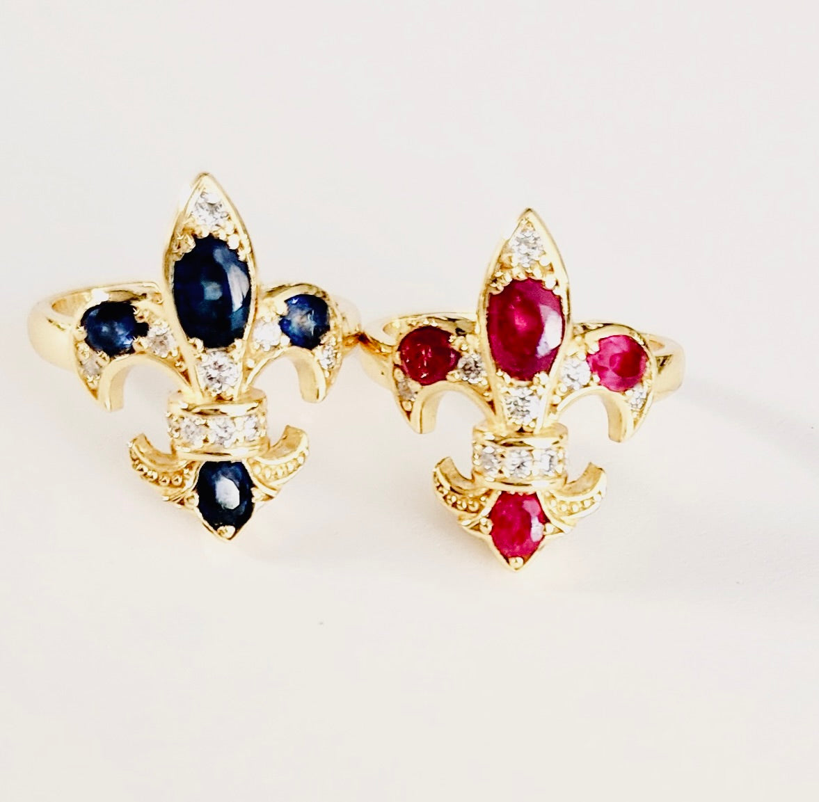 Saints & Saviors Gold Fleur De Lis SAPPHIRE and Ruby Rings with Diamonds side by side