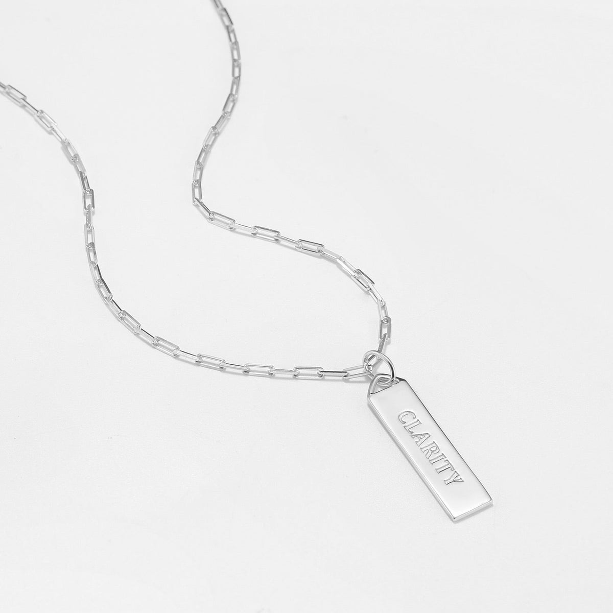 Braille hidden message necklace Clarity on Silver Vertical Bar on white background