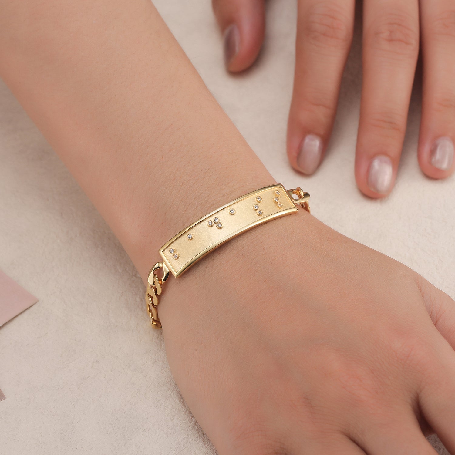 Touchstone Badass ID Link Bracelet in Gold with Braille Crystals on Model
