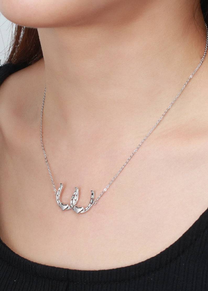 Saints and Saviors Silver Double Your Luck Horseshoes Necklace on model
