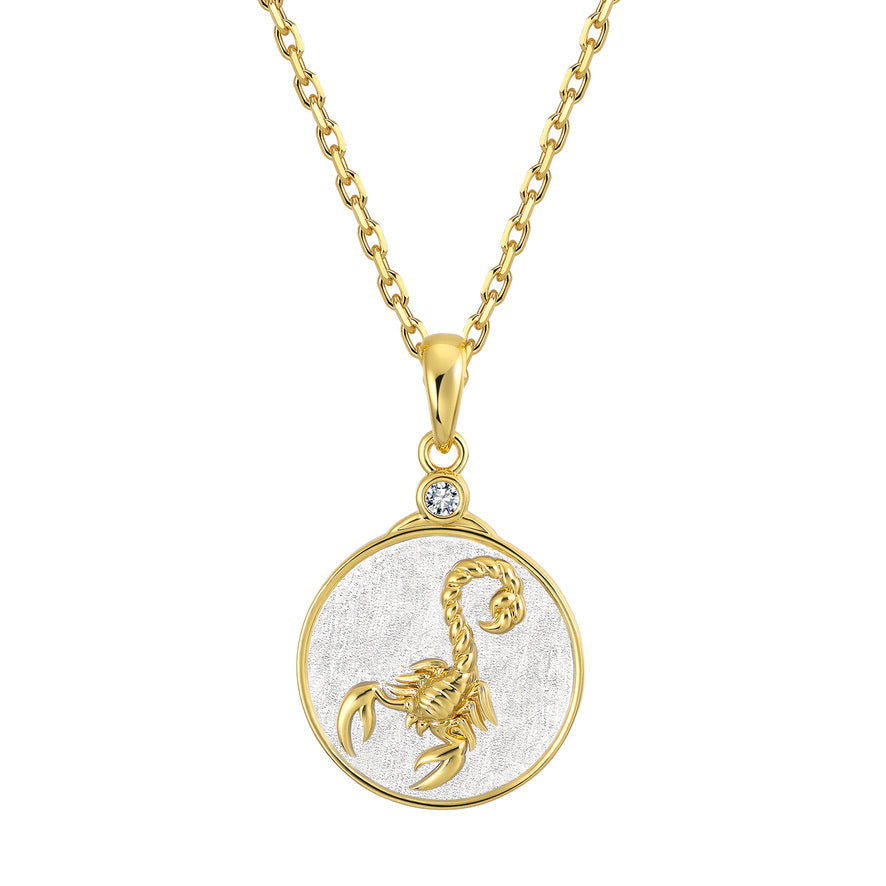 Gold scorpio Zodiac necklace with a Gold and Silver scorpion pendant on a white background