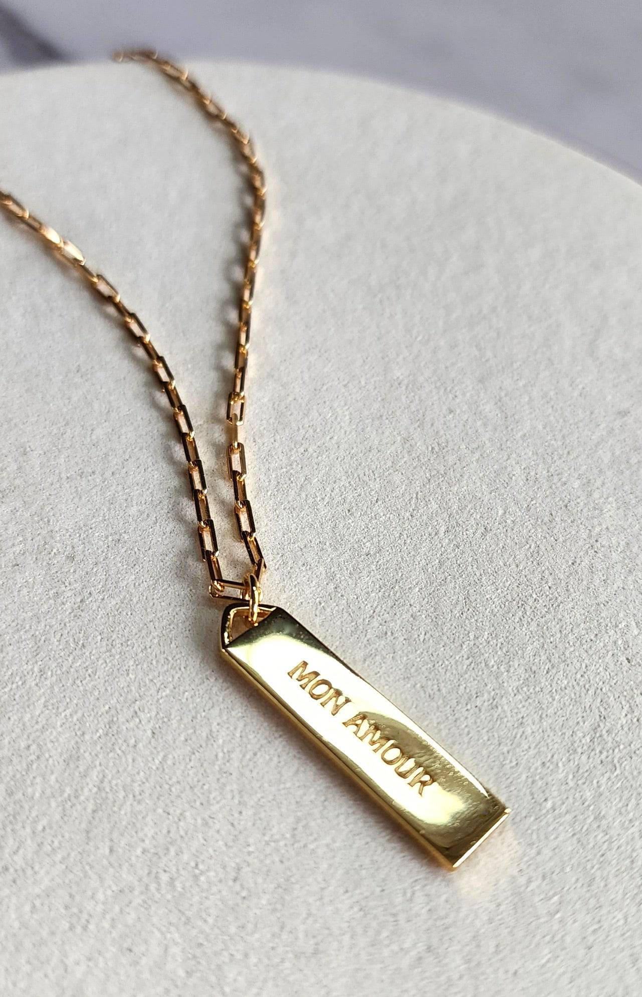 Touchstone Mon Amour Bar Necklace Gold showing "Mon Amour" in text on reverse