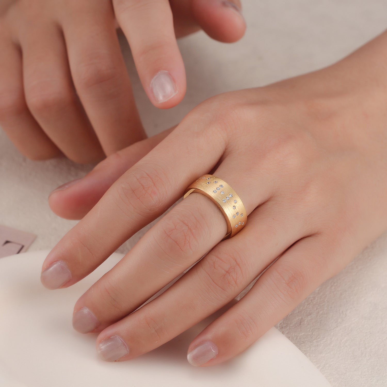 Touchstone Fearless Band Ring Brushed Gold with Braille Crystals on Model