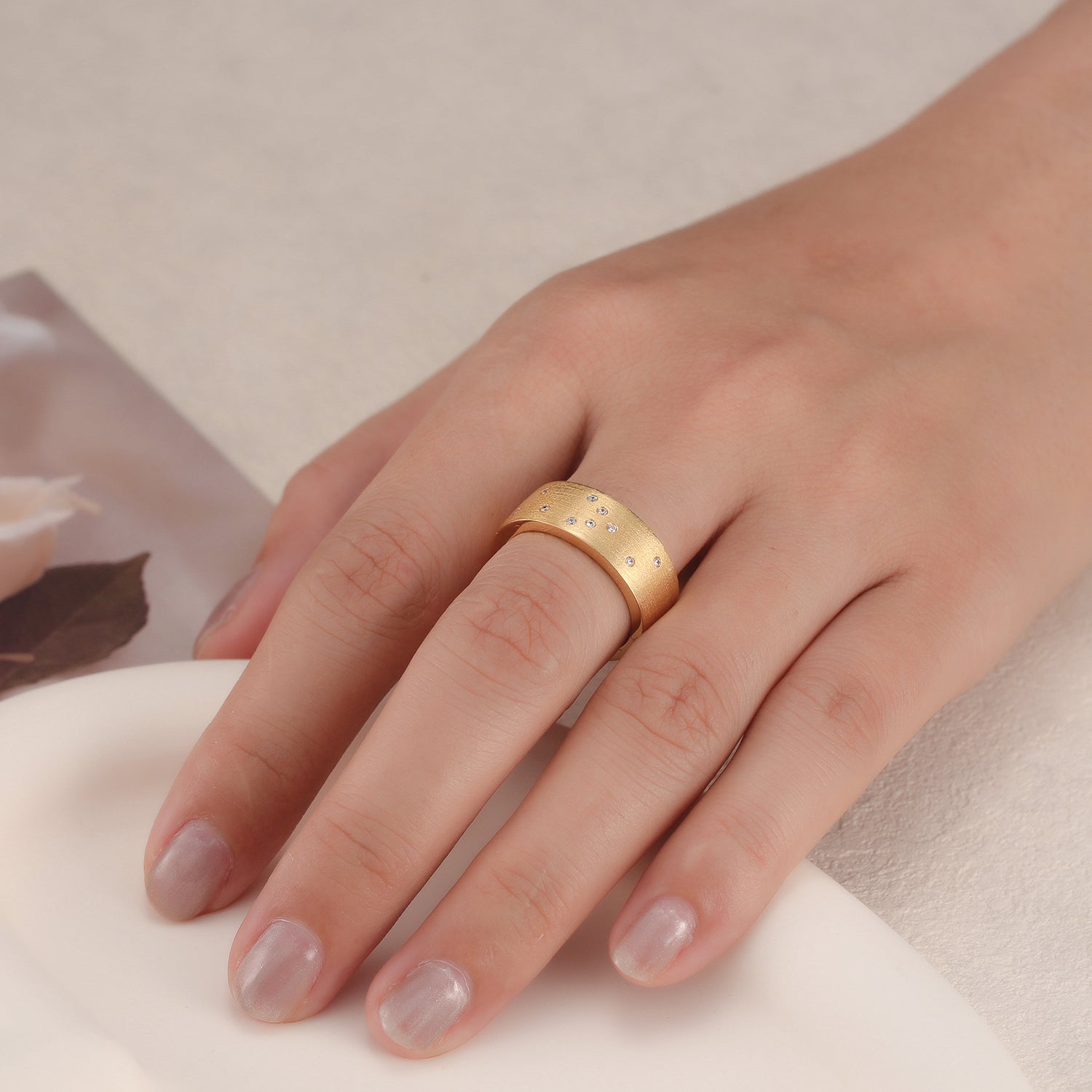 Touchstone HE>i Band Ring Brushed Gold Braille Crystals on Model's Hand