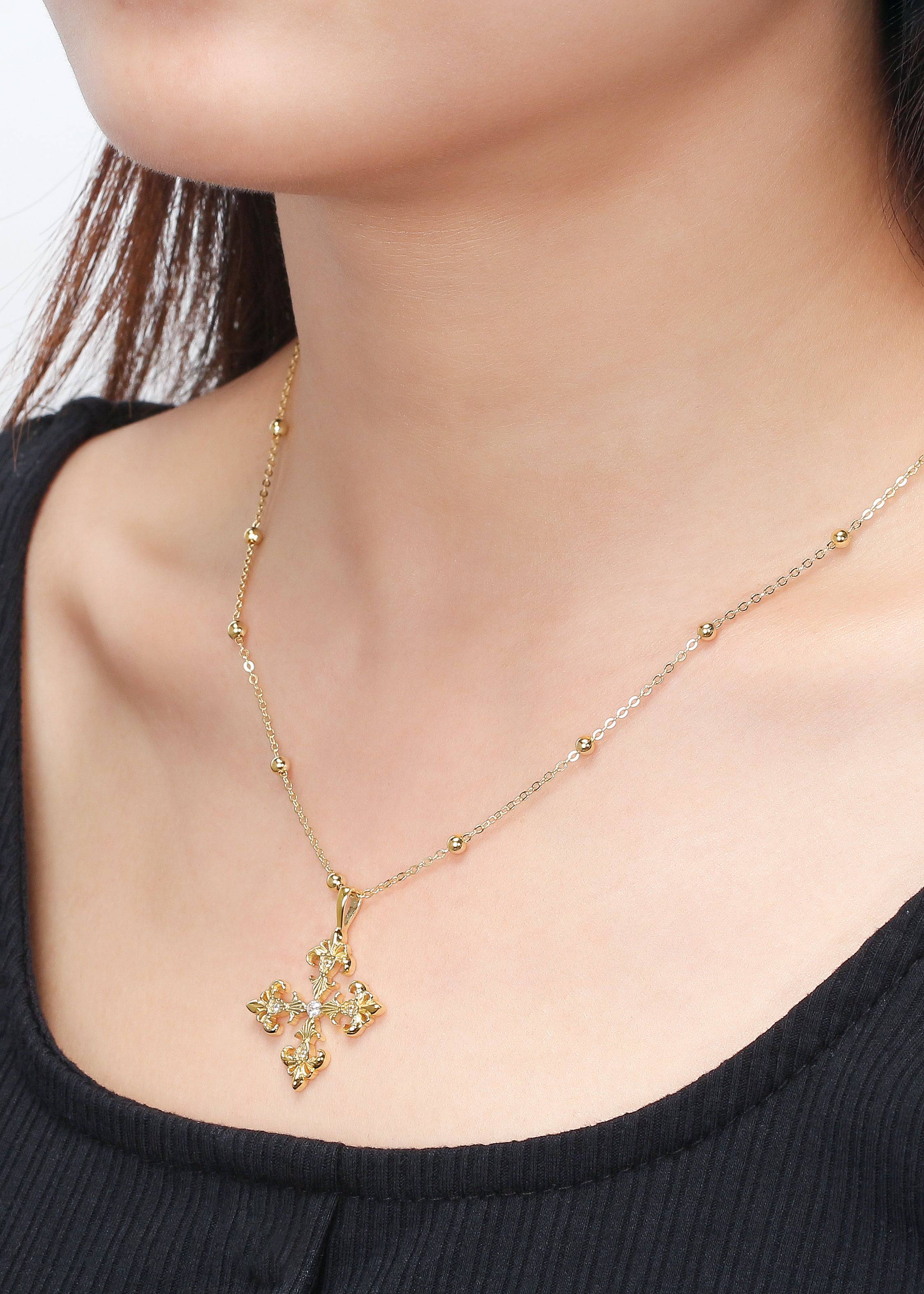 Saints and Saviors Fleur De Lis Deni Cross Necklace Gold on model