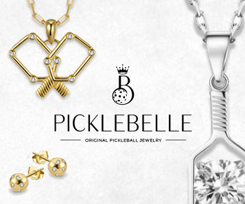 Gold and silver jewelry with Picklebelle logo on a white background
