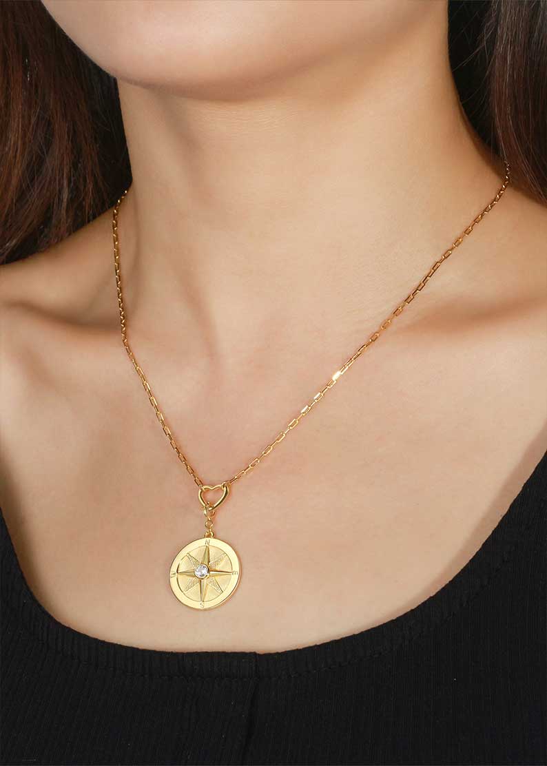 Saints and Saviors We Wander Gold Compass Necklace on model