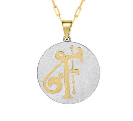 Saints & Saviors Fancy Initial Pendant Necklace elaborate gold F on silver disc on white background