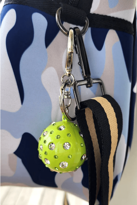 Pickleball Crystal Ball Keychain shown on Pickleball bag