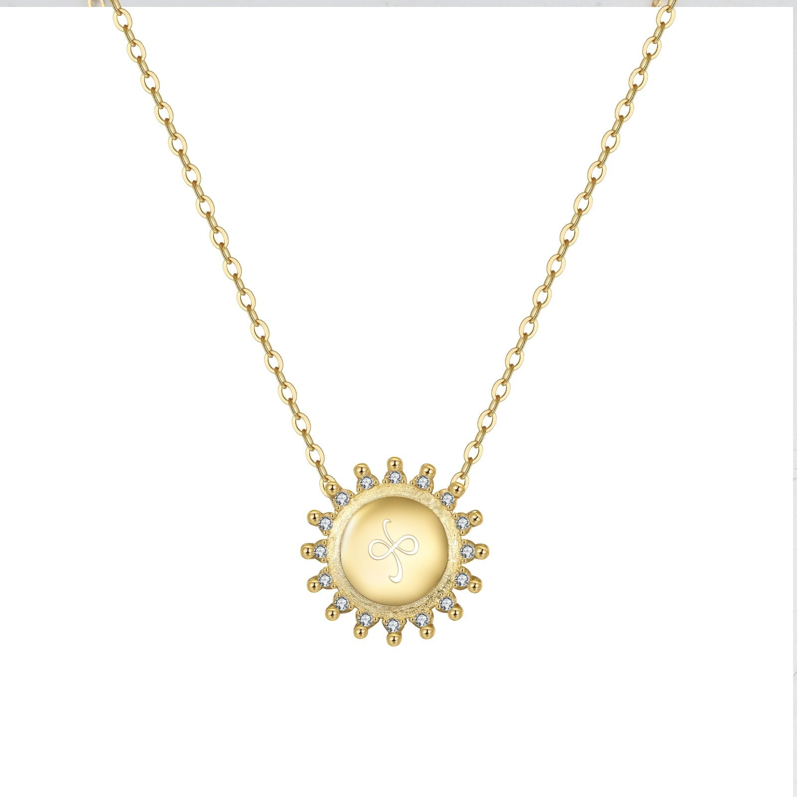 The Friendship Necklace Gold Sunburst with etched friendship symbol on white background