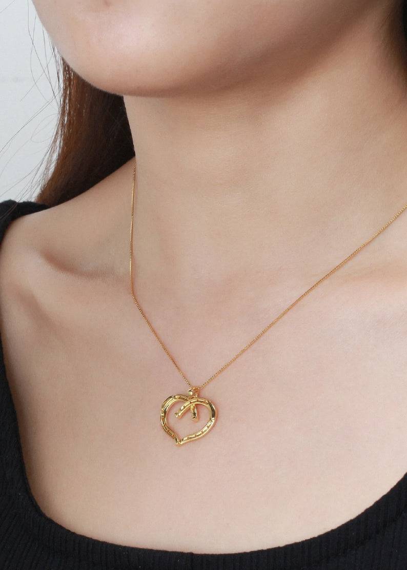 Saints and Saviors Wild at Heart Horseshoe Necklace in Gold on model