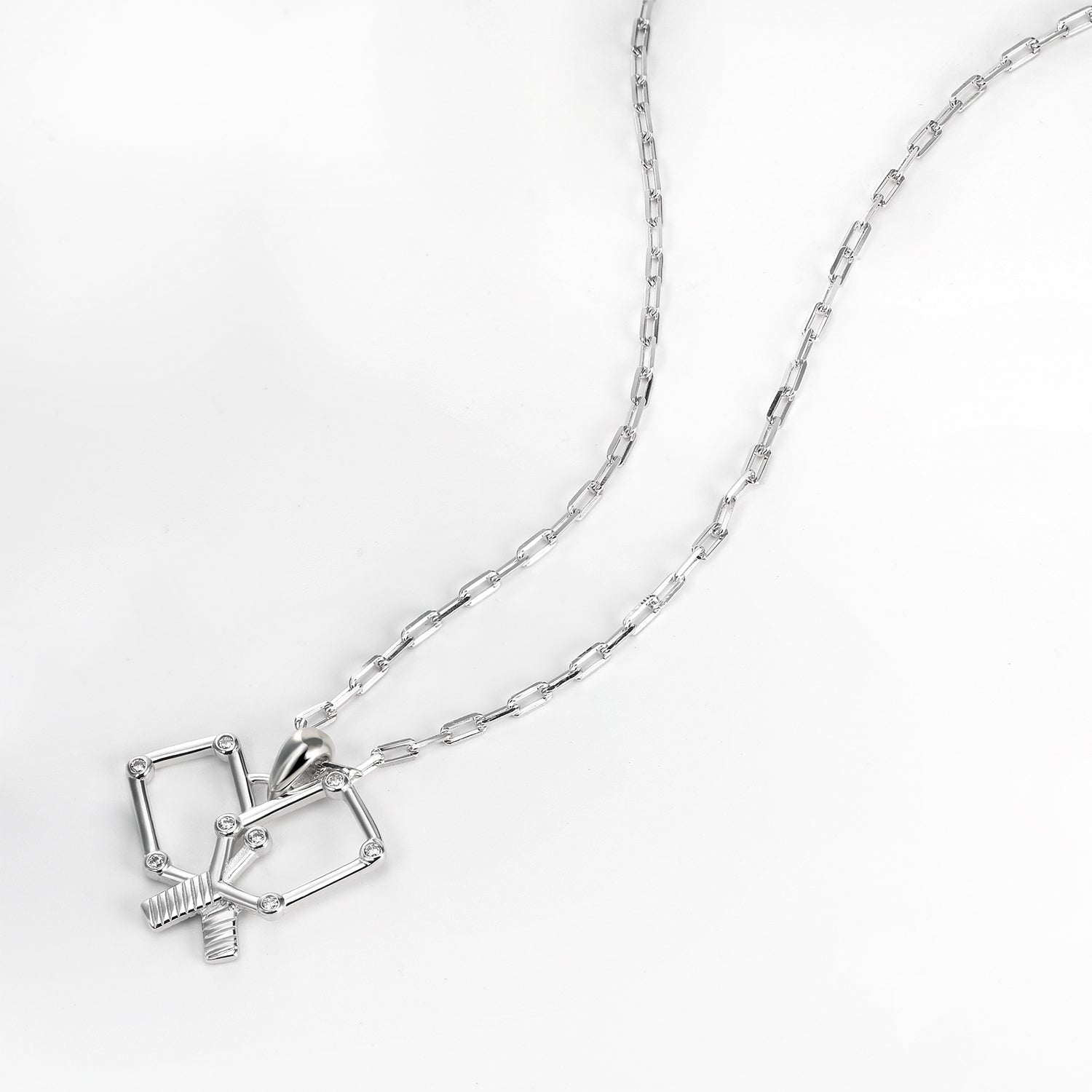 Silver necklace with a unique crossing pickleball paddles pendant on a white background