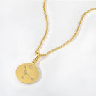 Gold necklace with a round pendant featuring a zodiac Cancer constellation on a white background