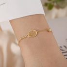 LoveMatch Tennis Ace Racquet and Ball on Gold Chain Bracelet on model